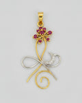 A gold and silver metal pendant featuring a stylized design with a lotus flower embellished with pink gemstones.