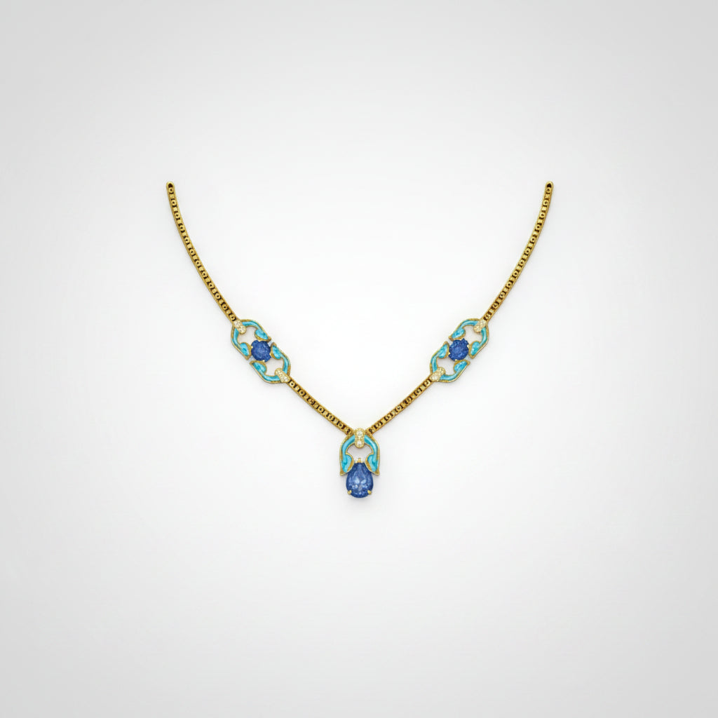 A delicate gold necklace featuring three oval links with light blue inlay and a central teardrop-shaped blue pendant.