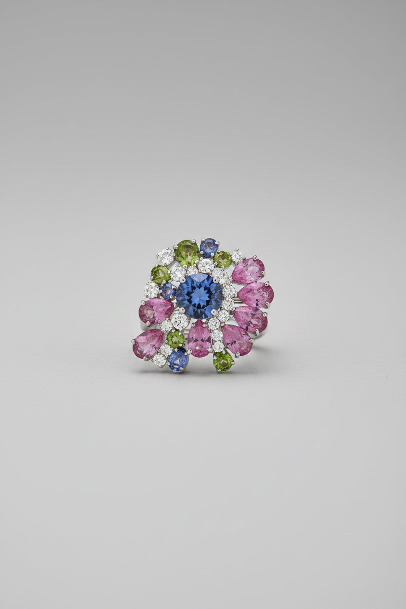 A small multicolor floral or paisley-style jewelry piece.